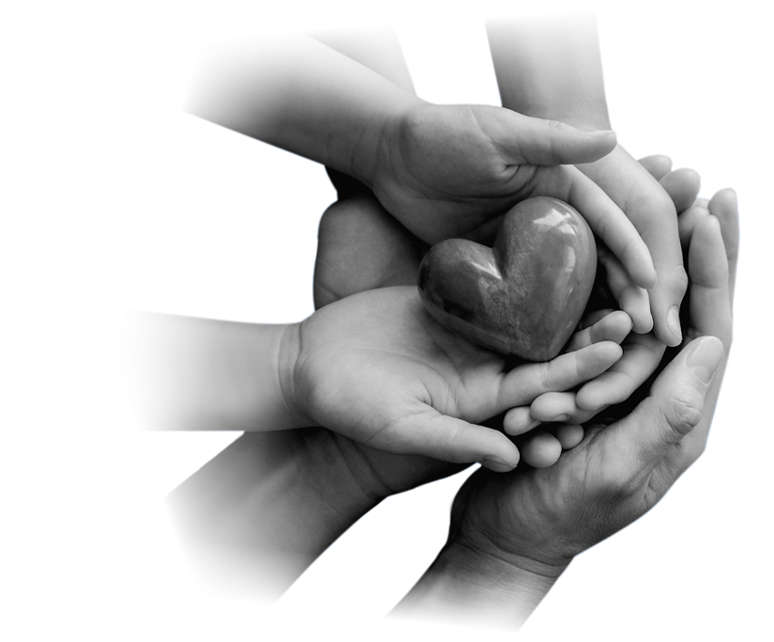 Three pairs of hands cupped together, holding a heart made of polished stone